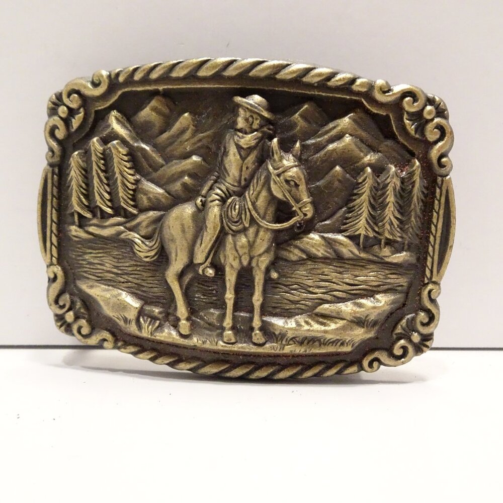 Vintage Cowboy Riding Horse Belt Buckle Mountains Pine Trees Horseback
